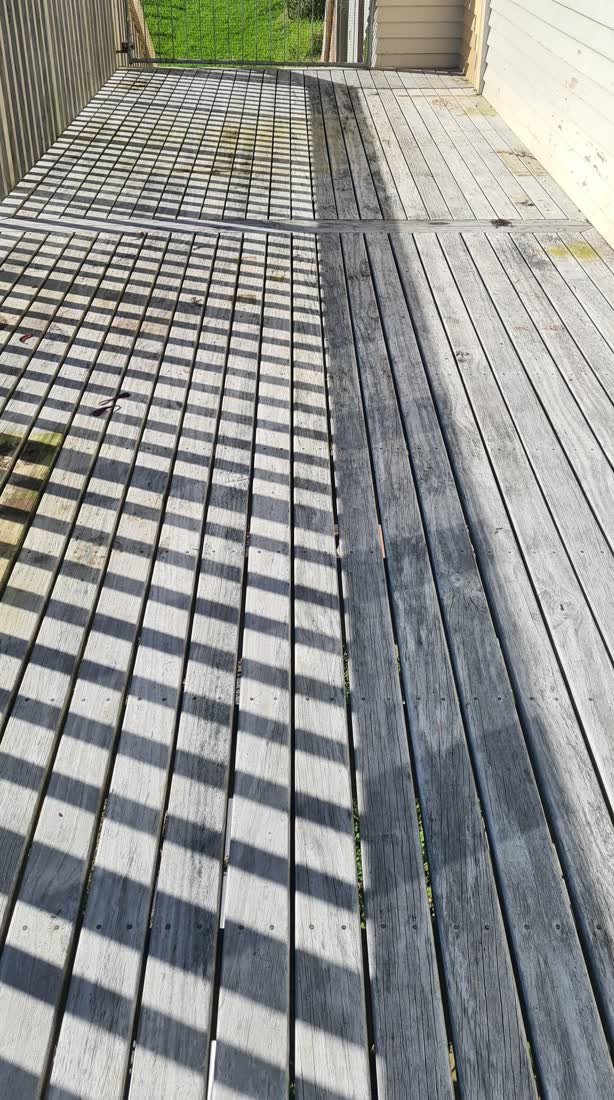 A timber deck before cleaning — grey, grimy and weathered